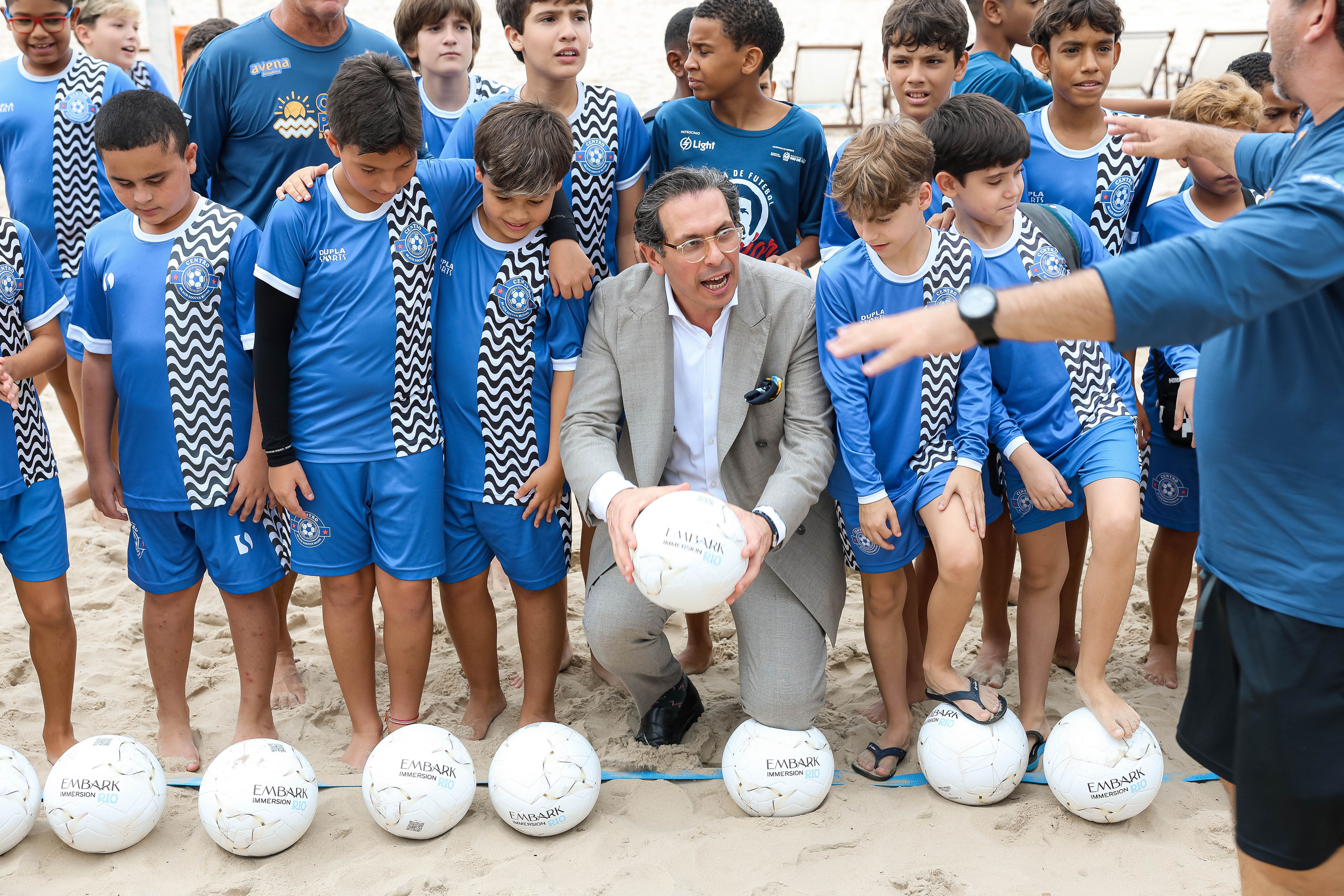 Children gathered with footballs during Chris Carnero Day
