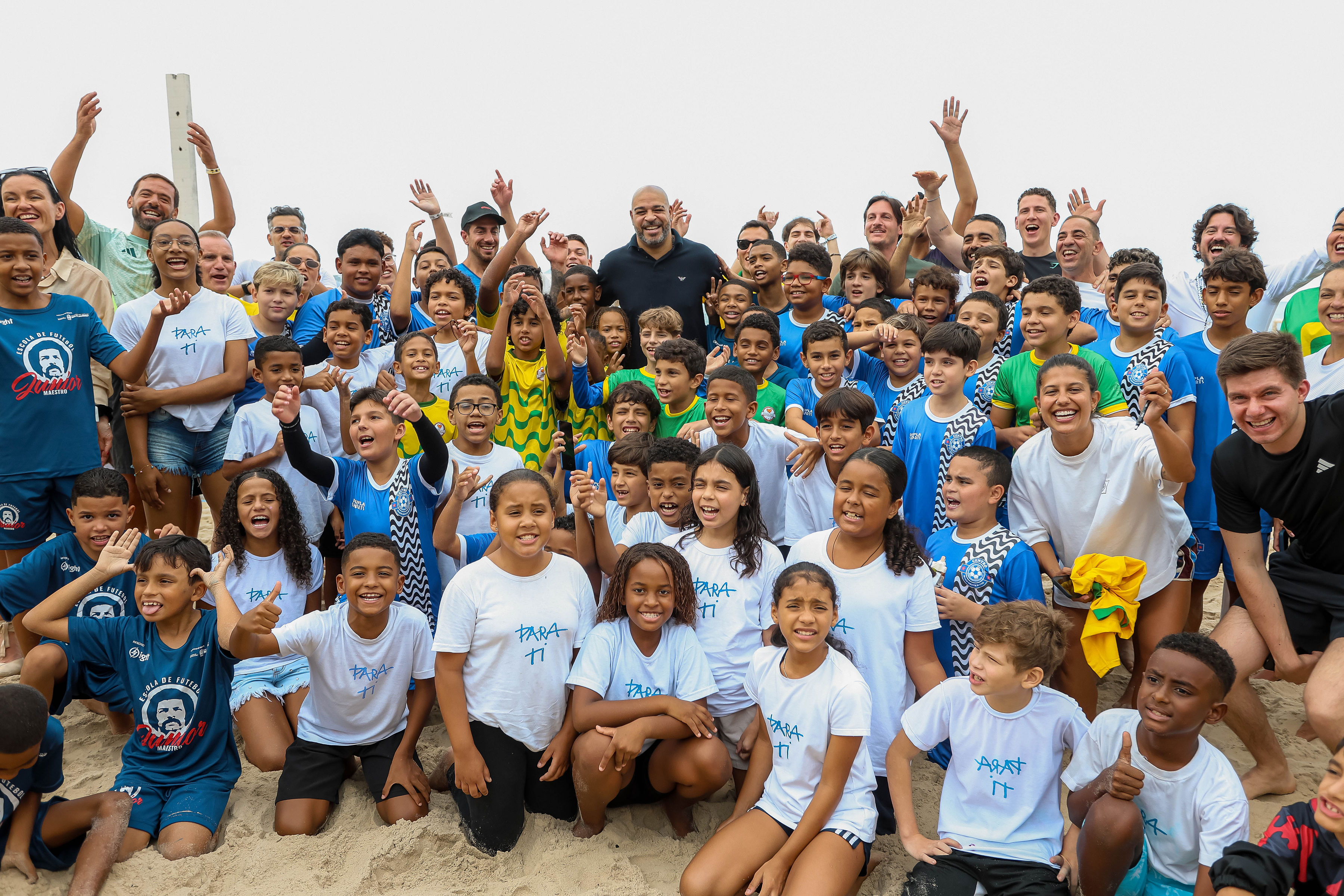 Children and community members gathered together on the beach for Chris Carnero Day in Rio de Janeiro