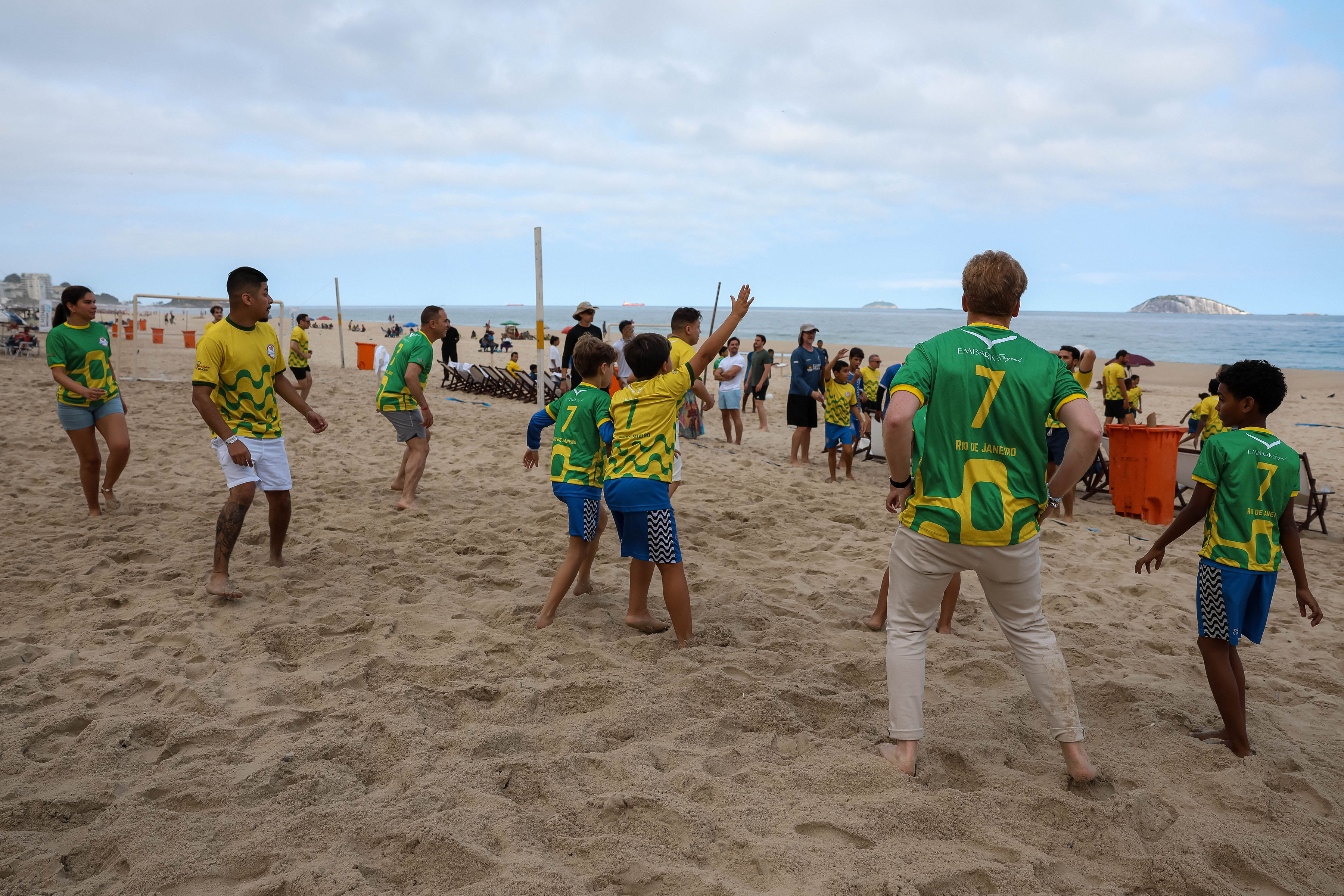 Children playing football on the beach during Chris Carnero Day